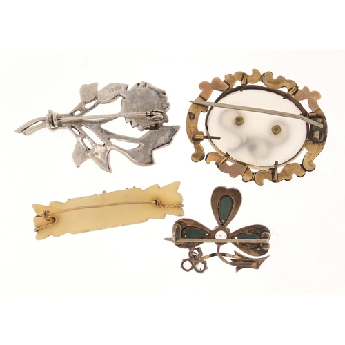 2586 - Four Victorian and later brooches, some set with turquoise and clear stones, the largest 4.5cm in le... 