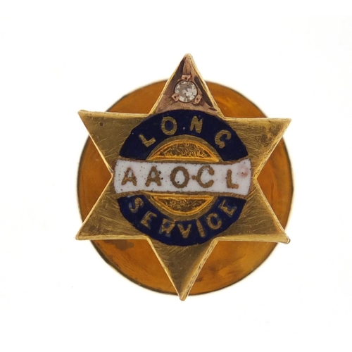 2591 - 9ct gold and enamel Anglo American oil company lapel pin, set with a diamond, housed in a fitted box... 