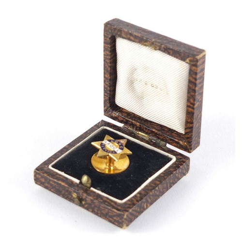 2591 - 9ct gold and enamel Anglo American oil company lapel pin, set with a diamond, housed in a fitted box... 