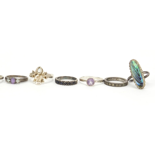 2630 - Seventeen silver rings, some set with semi precious stones, various sizes, 48.6g