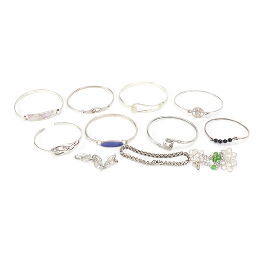 2602 - Eleven silver bracelets including some enamelled and some set with semi precious stones, 94.0g