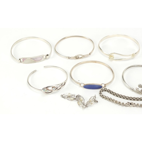 2602 - Eleven silver bracelets including some enamelled and some set with semi precious stones, 94.0g