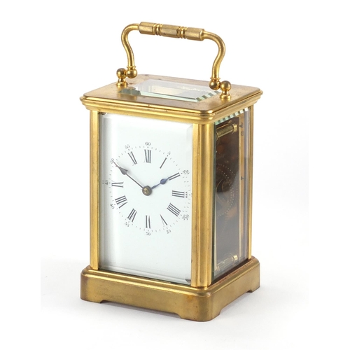 82A - Gilt brass carriage clock with enamelled dial, Roman numerals and velvet lined case, the back plate ... 