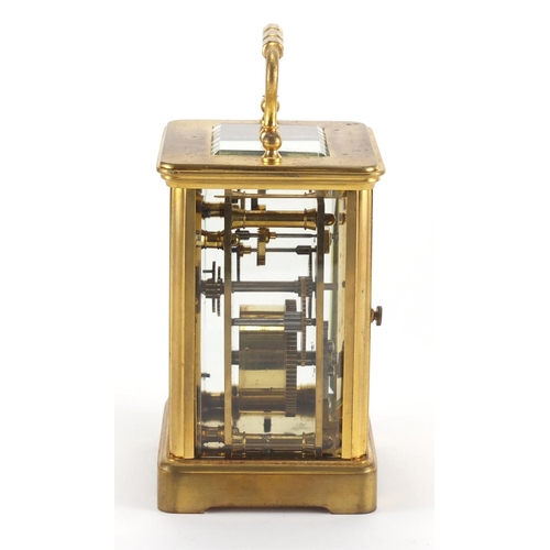 82A - Gilt brass carriage clock with enamelled dial, Roman numerals and velvet lined case, the back plate ... 