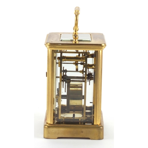 82A - Gilt brass carriage clock with enamelled dial, Roman numerals and velvet lined case, the back plate ... 