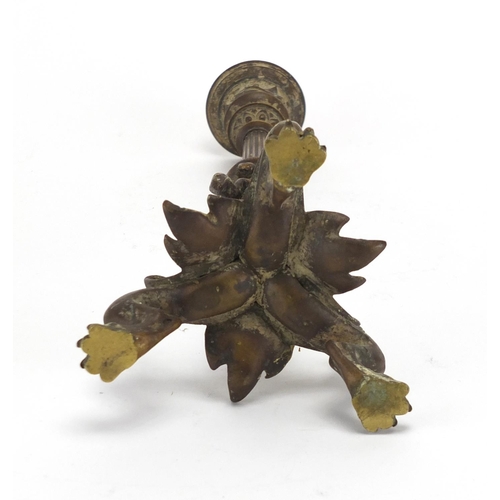 66 - 19th century patinated bronze candlestick with paw feet, the column decorated in relief with a lizar... 