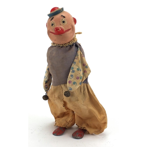 146 - 19th century hand painted clockwork clown, 26.5cm high