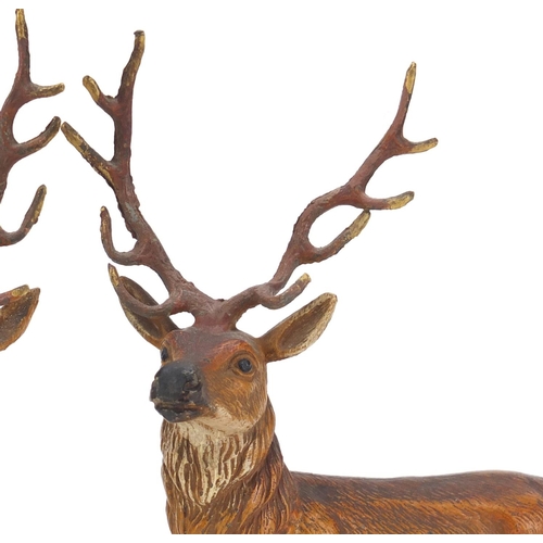 120 - Pair of cold painted spelter stags, each 20cm high