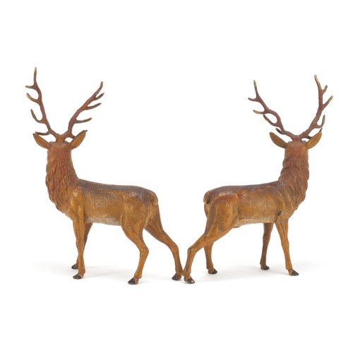 120 - Pair of cold painted spelter stags, each 20cm high