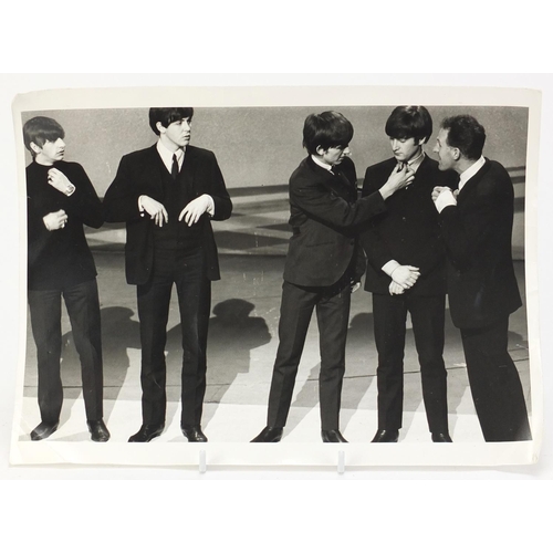 201 - Vintage black and white photograph of the Beatles on stage, 30.5cm x 23.5cm