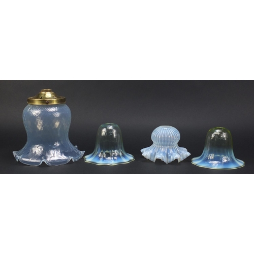 561 - Four Art Nouveau vaseline glass shades including a pair possibly by Powell for Whitefriars, the larg... 