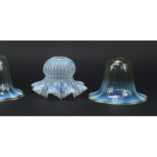 561 - Four Art Nouveau vaseline glass shades including a pair possibly by Powell for Whitefriars, the larg... 