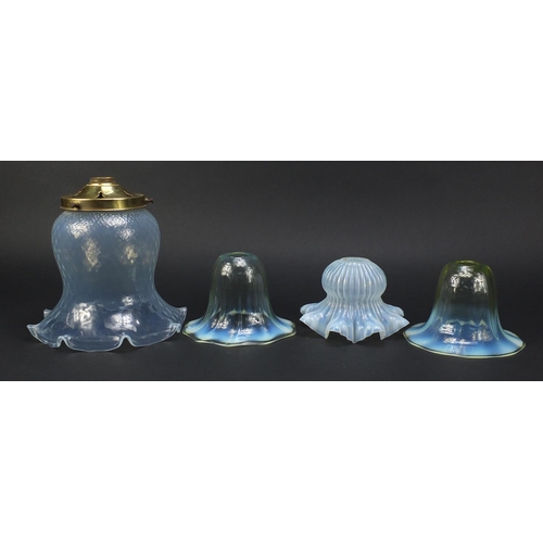 561 - Four Art Nouveau vaseline glass shades including a pair possibly by Powell for Whitefriars, the larg... 