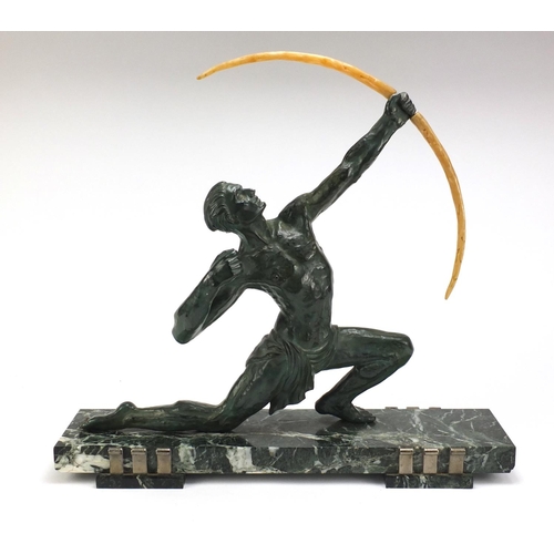 597 - Art Deco patinated spelter sculpture of an archer raised on a rectangular marble base, 52.5cm high