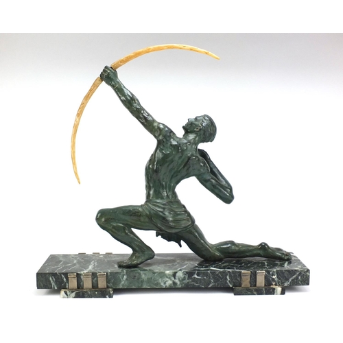 597 - Art Deco patinated spelter sculpture of an archer raised on a rectangular marble base, 52.5cm high