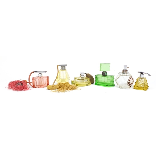 566 - Six Art Deco cut glass atomisers/scent bottles, the largest 11.5cm high