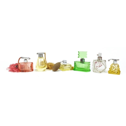 566 - Six Art Deco cut glass atomisers/scent bottles, the largest 11.5cm high