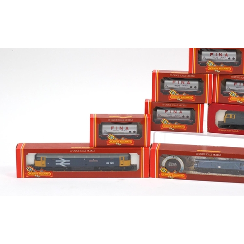 151 - Hornby 00 guage model railway with boxes, comprising four diesel locomotives and ten advertising wag... 