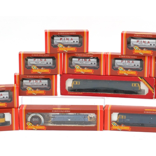 151 - Hornby 00 guage model railway with boxes, comprising four diesel locomotives and ten advertising wag... 