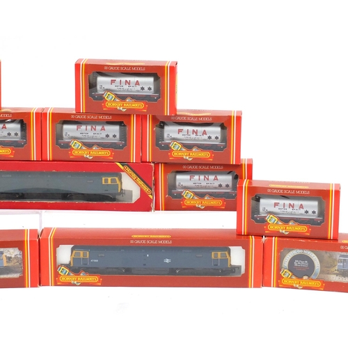 151 - Hornby 00 guage model railway with boxes, comprising four diesel locomotives and ten advertising wag... 