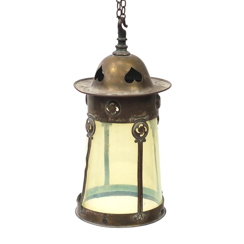 562 - Art Nouveau brass lantern housing a vaseline glass shade, 33cm high