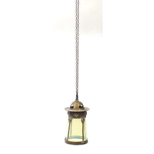 562 - Art Nouveau brass lantern housing a vaseline glass shade, 33cm high