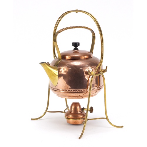 592 - German secessionist copper and brass teapot on stand with burner, impressed marks to the underside o... 