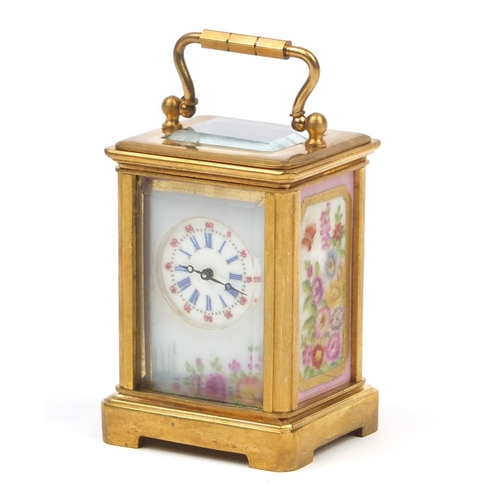 54 - Gilt brass miniature carriage clock with Sevres style porcelain panels decorated with flowers, numbe... 