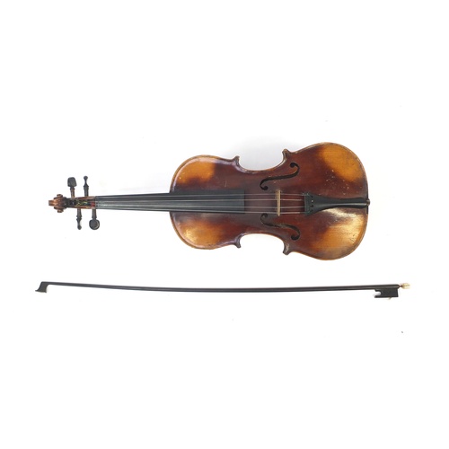 88 - Old wooden violin with bow and case, the violin bearing a Stradivarius paper label, the violin back ... 