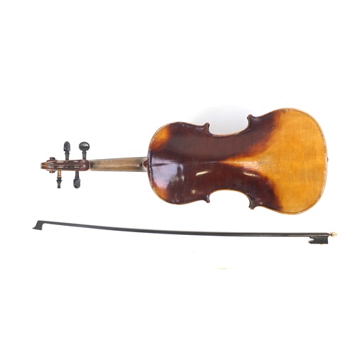 88 - Old wooden violin with bow and case, the violin bearing a Stradivarius paper label, the violin back ... 