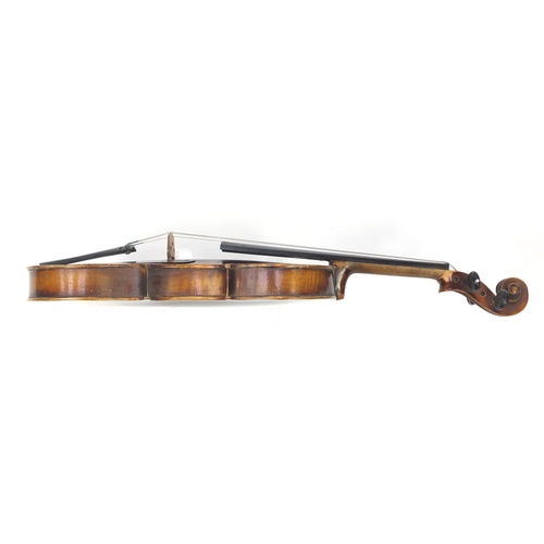 88 - Old wooden violin with bow and case, the violin bearing a Stradivarius paper label, the violin back ... 