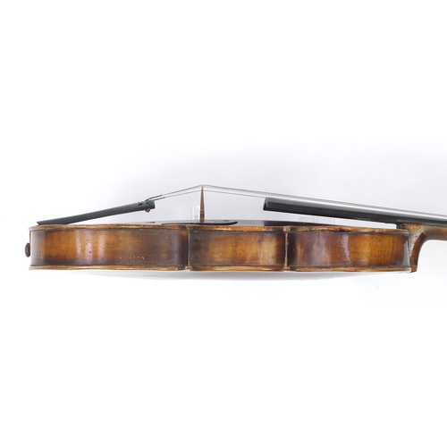 88 - Old wooden violin with bow and case, the violin bearing a Stradivarius paper label, the violin back ... 