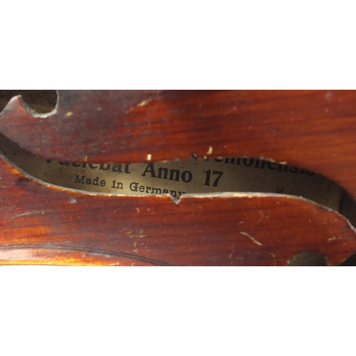 88 - Old wooden violin with bow and case, the violin bearing a Stradivarius paper label, the violin back ... 