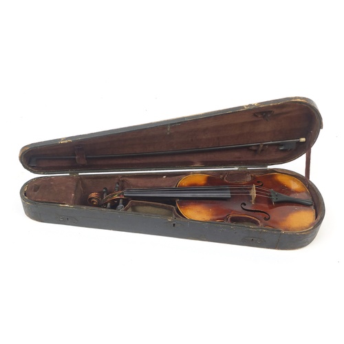 88 - Old wooden violin with bow and case, the violin bearing a Stradivarius paper label, the violin back ... 