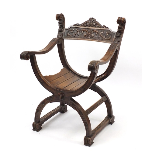 2007 - Italian oak savonarola chair carved with grotesque masks, 84cm high