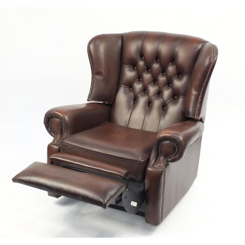 2048 - Brown leather wingback reclining armchair with button back, 99cm high