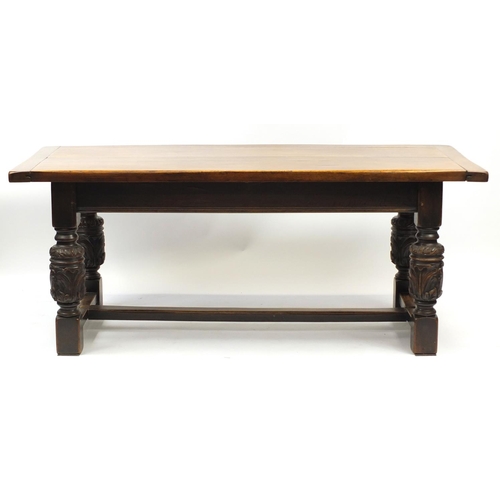 2008 - Oak refectory table with carved cup and cover bulbous legs united by a H stretcher, 73cm H x 184cm W... 