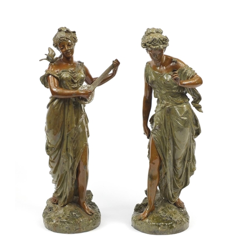 2100 - Pair of Art Nouveau cold painted spelter figures of maidens, the largest 49cm high