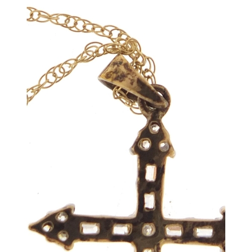 2535 - 9ct gold clear stone cross pendant on a 9ct gold necklace, the pendant 3.5cm in length, 2.2g