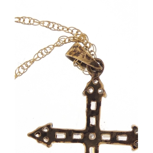 2535 - 9ct gold clear stone cross pendant on a 9ct gold necklace, the pendant 3.5cm in length, 2.2g