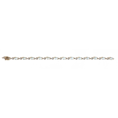 2525 - 9ct gold blue stone and diamond bracelet, 18cm in length, 7.5g