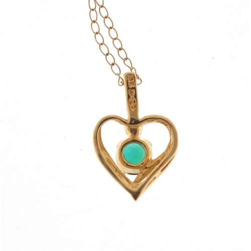 2554 - 9ct gold green stone love heart pendant on a 9ct gold necklace, 0.9g