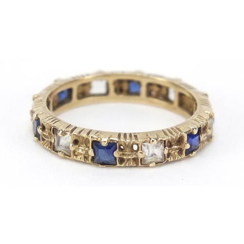 2565 - 9ct gold blue and clear stone eternity ring, size L, 2.2g