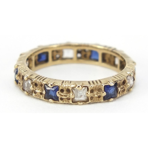 2565 - 9ct gold blue and clear stone eternity ring, size L, 2.2g