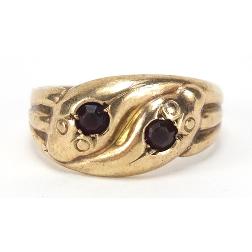 2564 - 9ct gold serpent ring set with garnets, size M, 2.5g