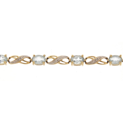 2533 - 9ct gold blue stone and diamond bracelet, 20cm in length, 6.2g