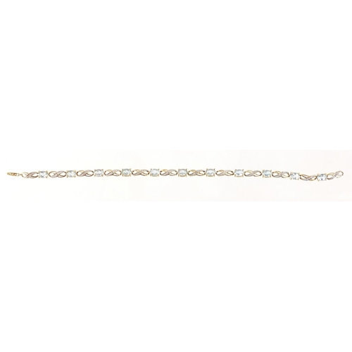 2533 - 9ct gold blue stone and diamond bracelet, 20cm in length, 6.2g