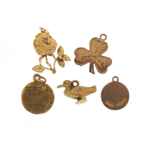 2558 - Five 9ct gold charms including St Christoper and a duck, 5.3g