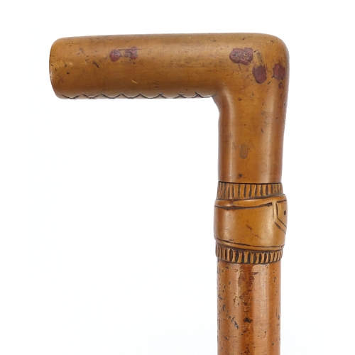 94 - Malacca walking stick with carved belt design collar, 82cm in length