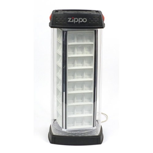 30 - Zippo lighter illuminated rotating display case, 93cm high